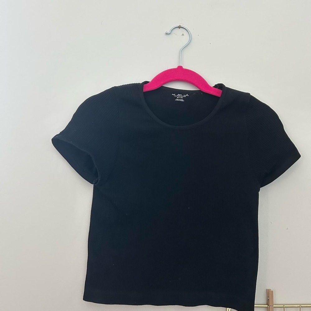 Urban Outfitters out from under black top